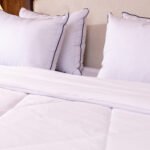Arctic Cloud duvet set folded on bed – 3-piece winter bedding