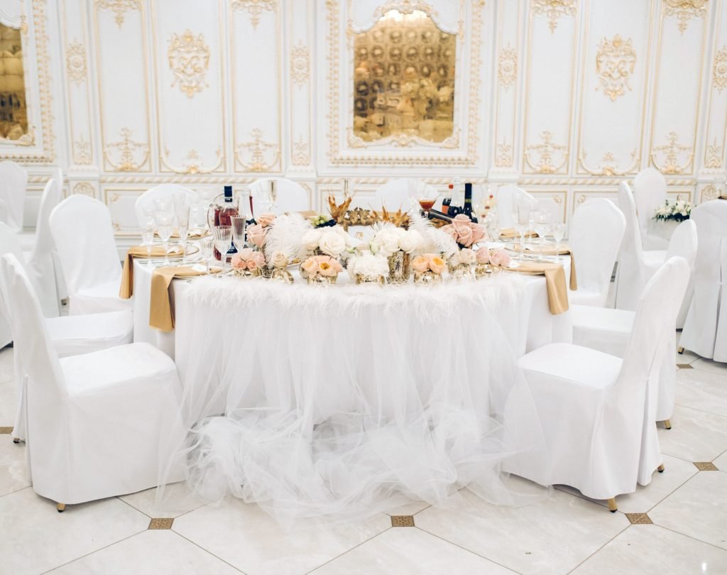 wedding table decoration with flowers on the table in the castle, table decor for dinner by candlelight.Dinner with candles.