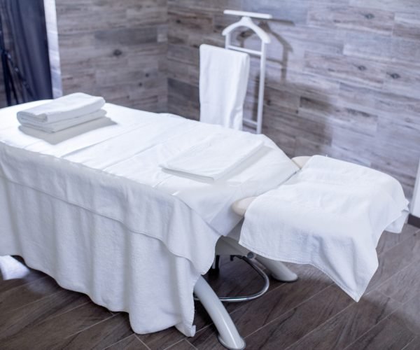 Interior of massage room in a modern spa salon. room prepared for a clients. equipment concept.